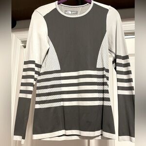 The North Face. Size small. Long sleeve shirt. Gray